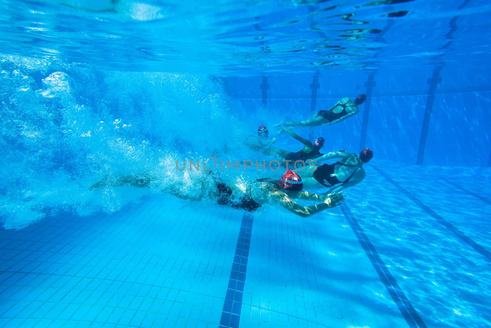 Girls Synchronized underwater swimming water action at national championships
