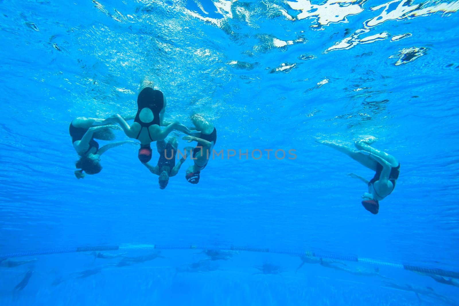 Girls Synchronized underwater swimming water action at national championships