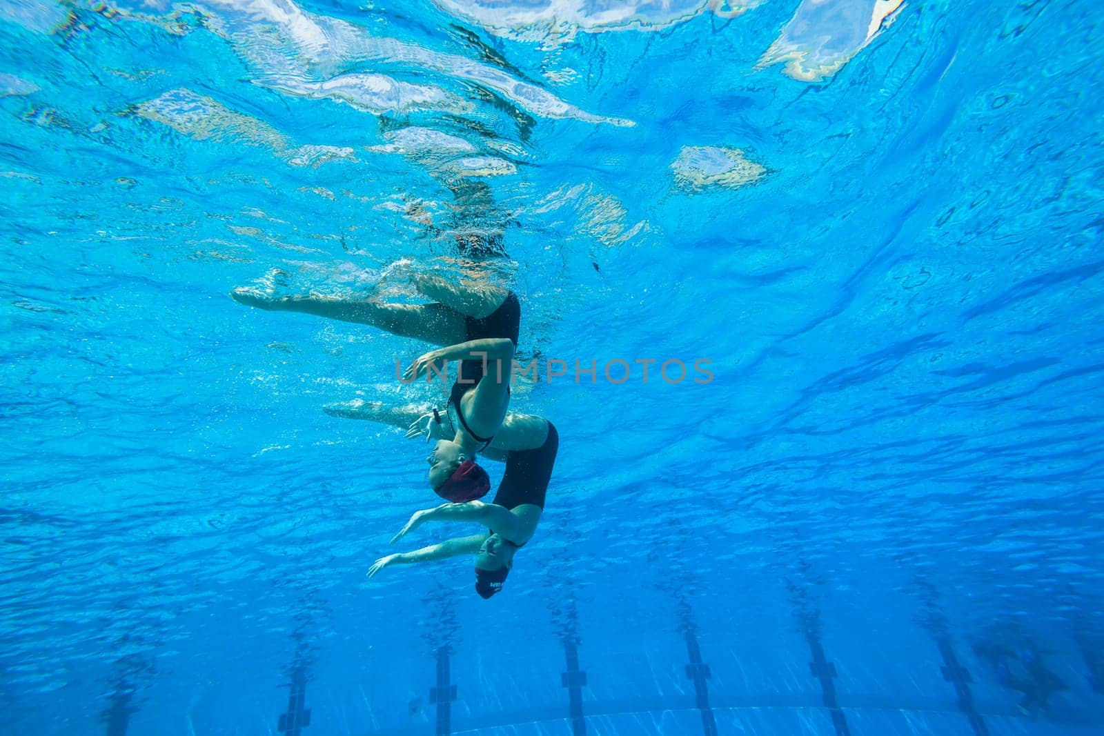 Girls Synchronized underwater swimming water action at national championships