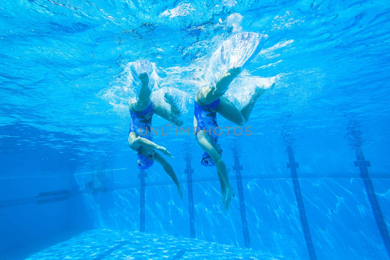 Girls Synchronized underwater swimming water action at national championships