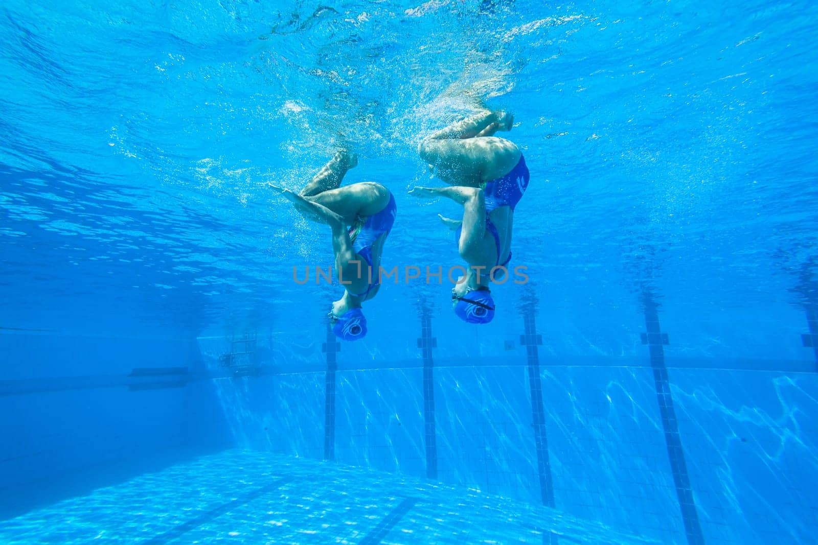 Girls Synchronized underwater swimming water action at national championships