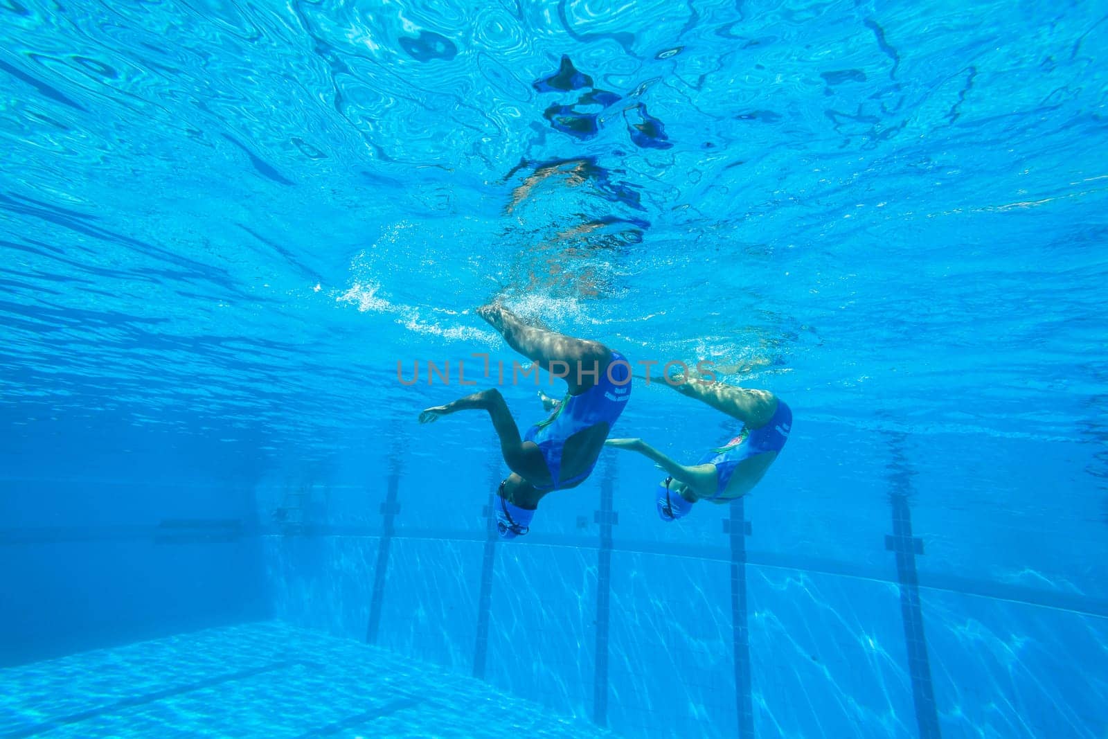 Girls Synchronized underwater swimming water action at national championships