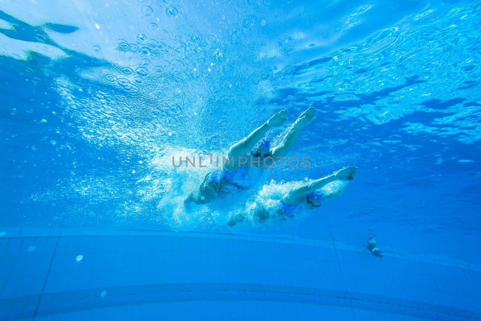 Girls Synchronized underwater swimming water action at national championships