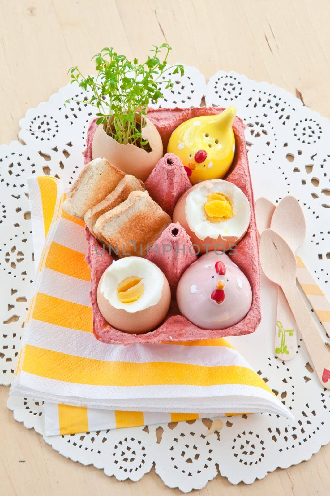 Cooked breakfast eggs with salt,pepper and small toast