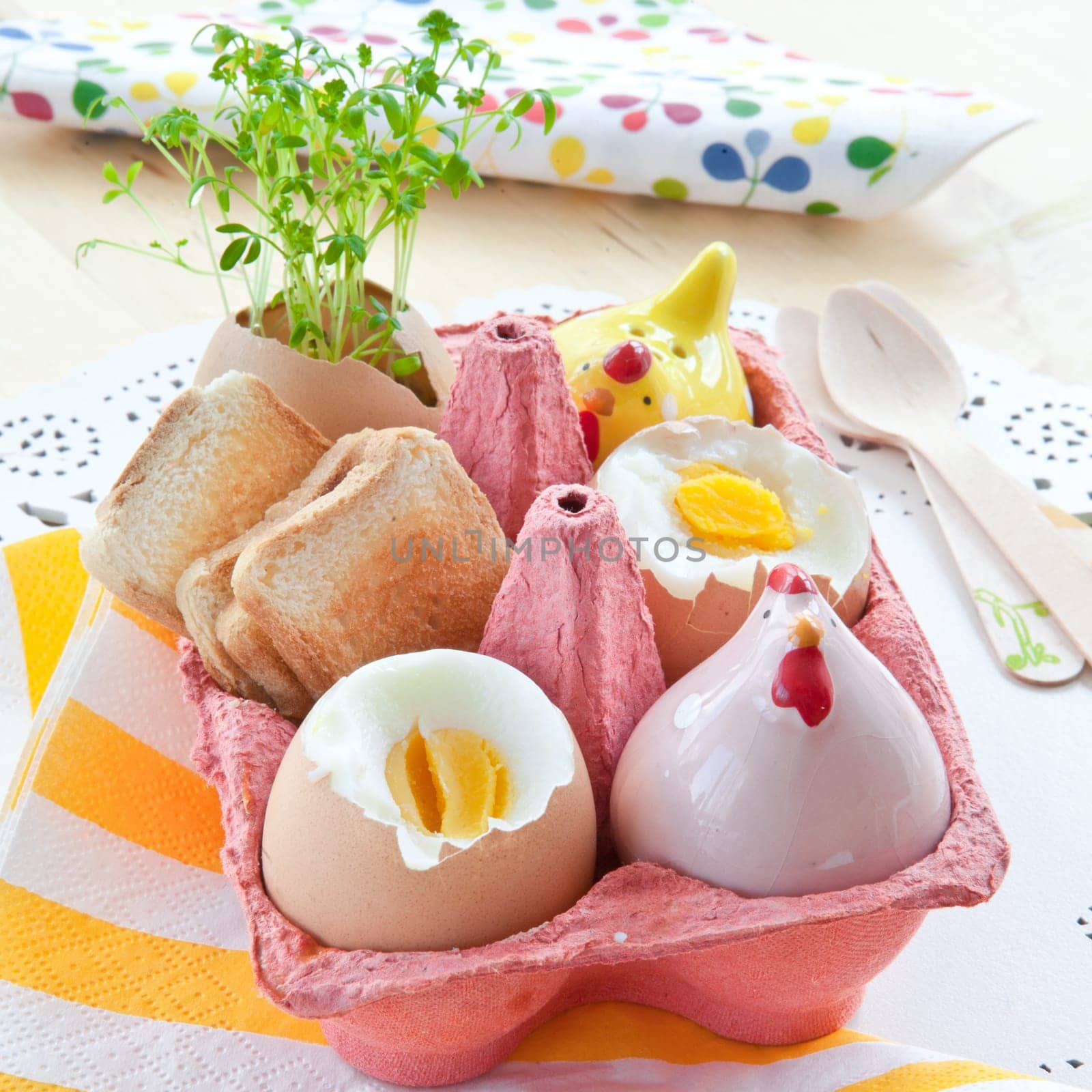 Cooked breakfast eggs with salt,pepper and small toast