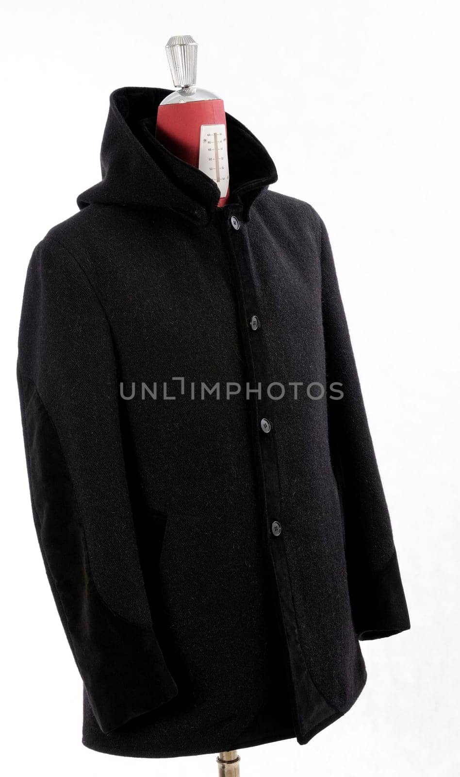 Woolen black coat, inserts and lining in velvet. Detachable hood.