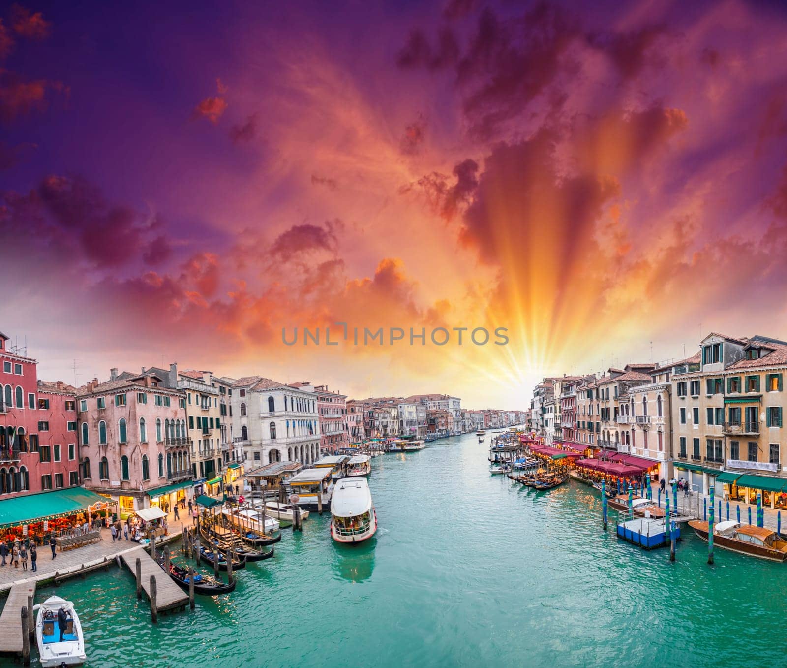 Venice. View of Grand Canal at dusk from Rialto Bridge.