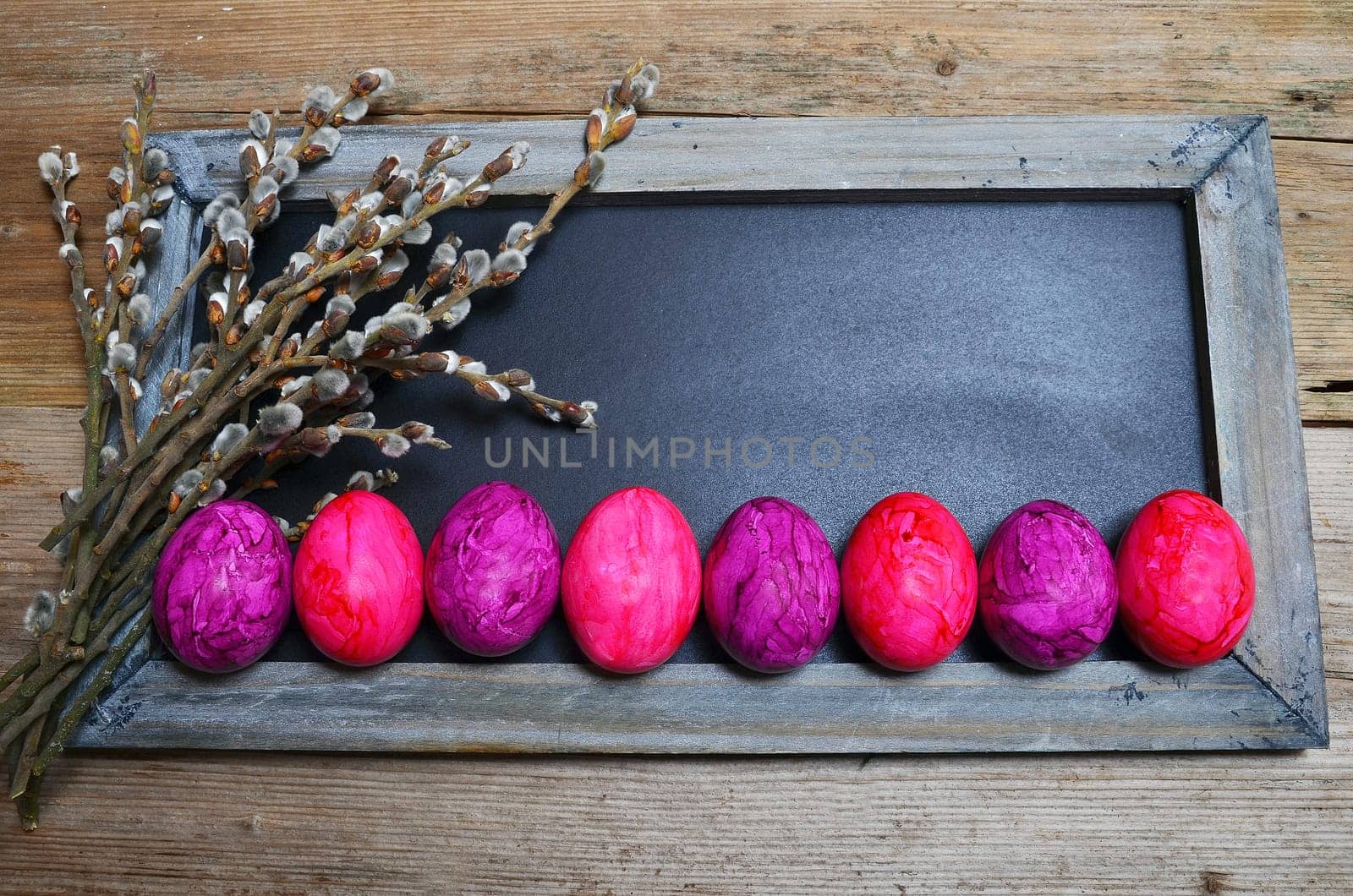 colorful Easter eggs wooden background