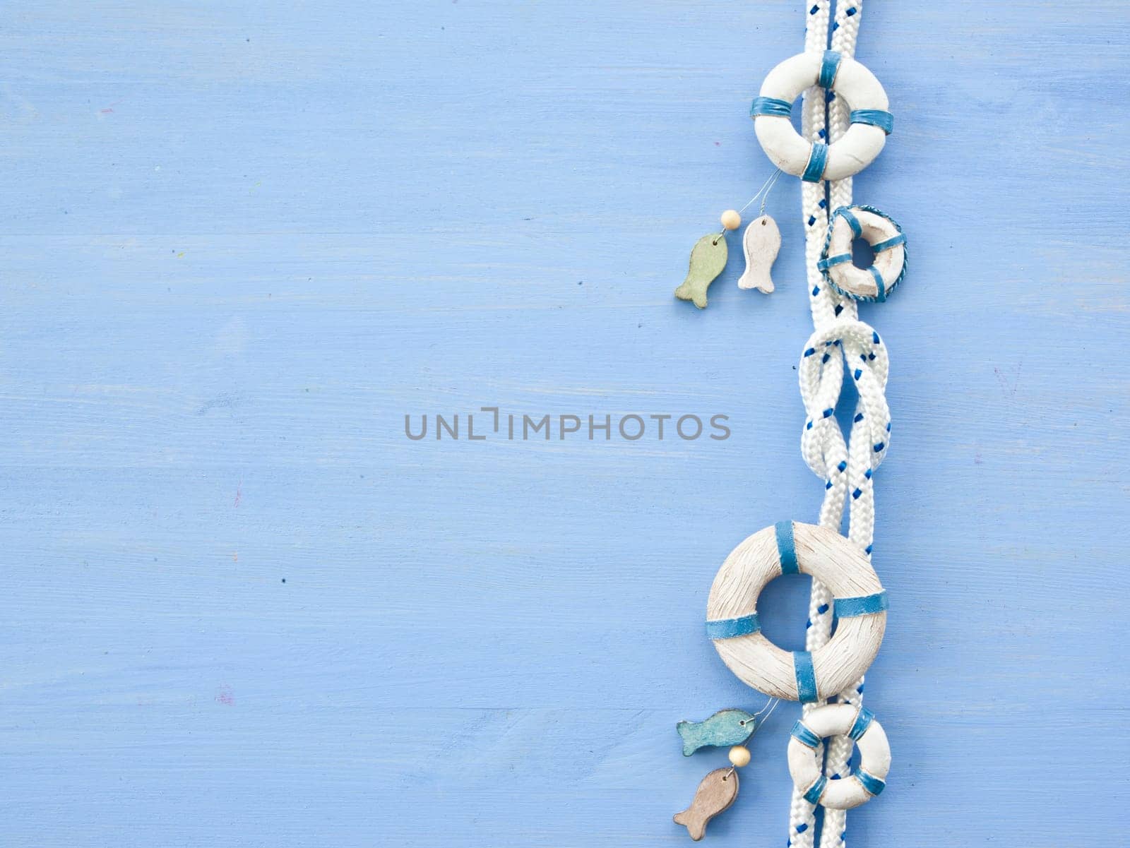 Maritime decoration and sailor knots on a blue background