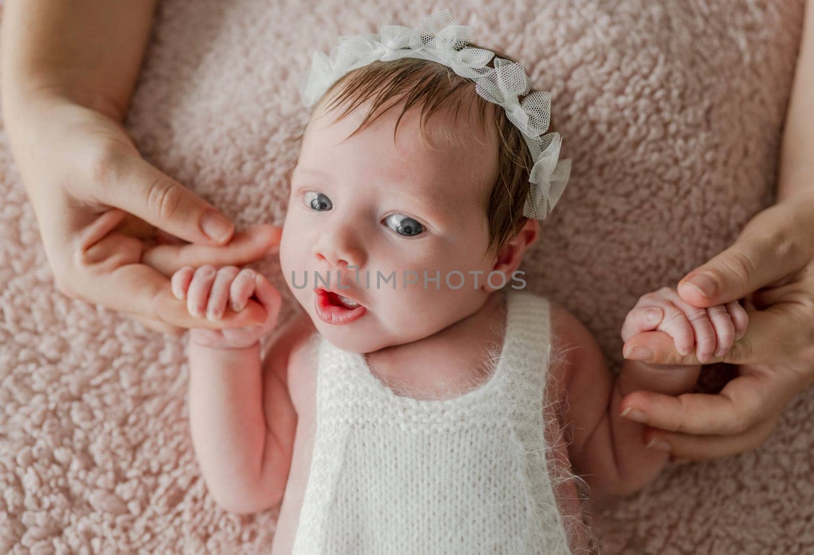 Newborn baby girl studio portrait by tan4ikk1