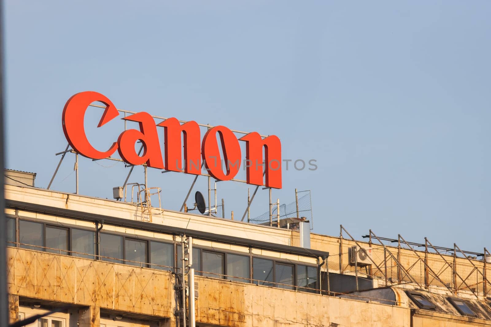 29 september 2023, Belgrade, Serbia - Roof advertising construction - canon logo - manufacturing of photo cameras, telephoto shot