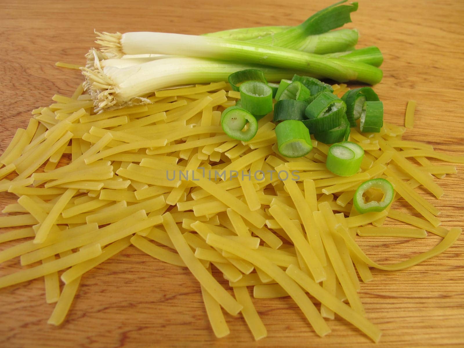 Narrow ribbon noodles and spring onions