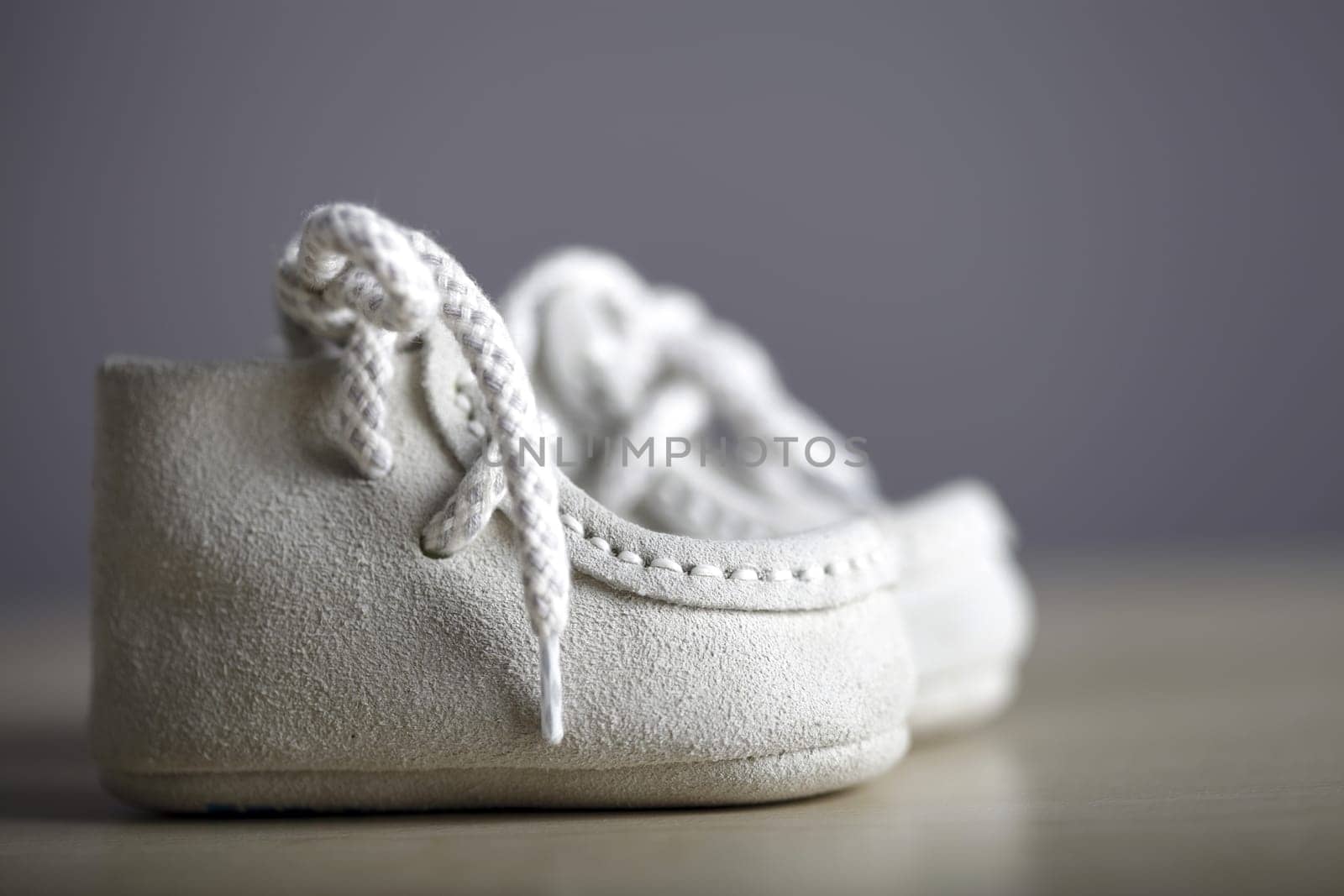 Close up photo of a pail of small slippers for toddlers