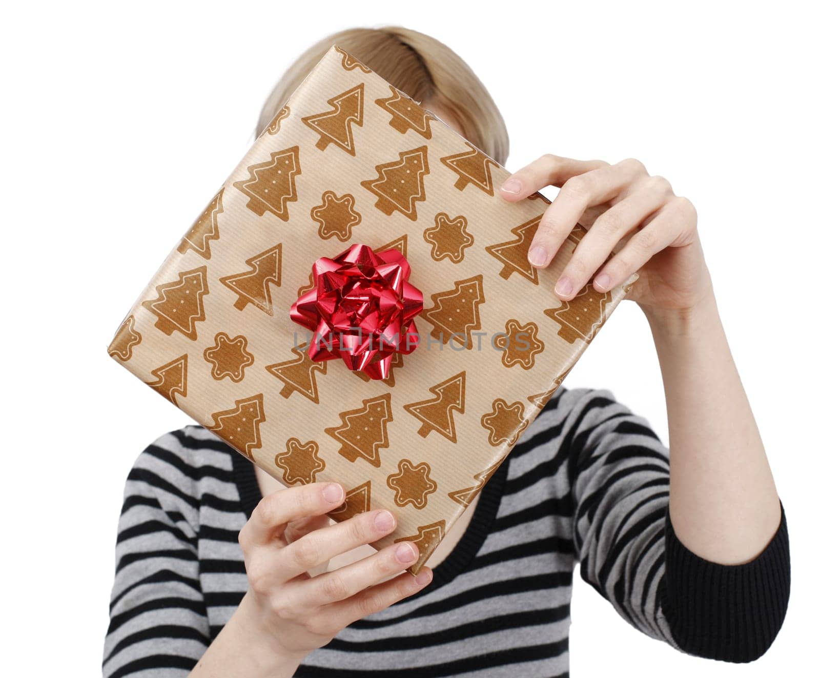 Young woman holding a present in hands
