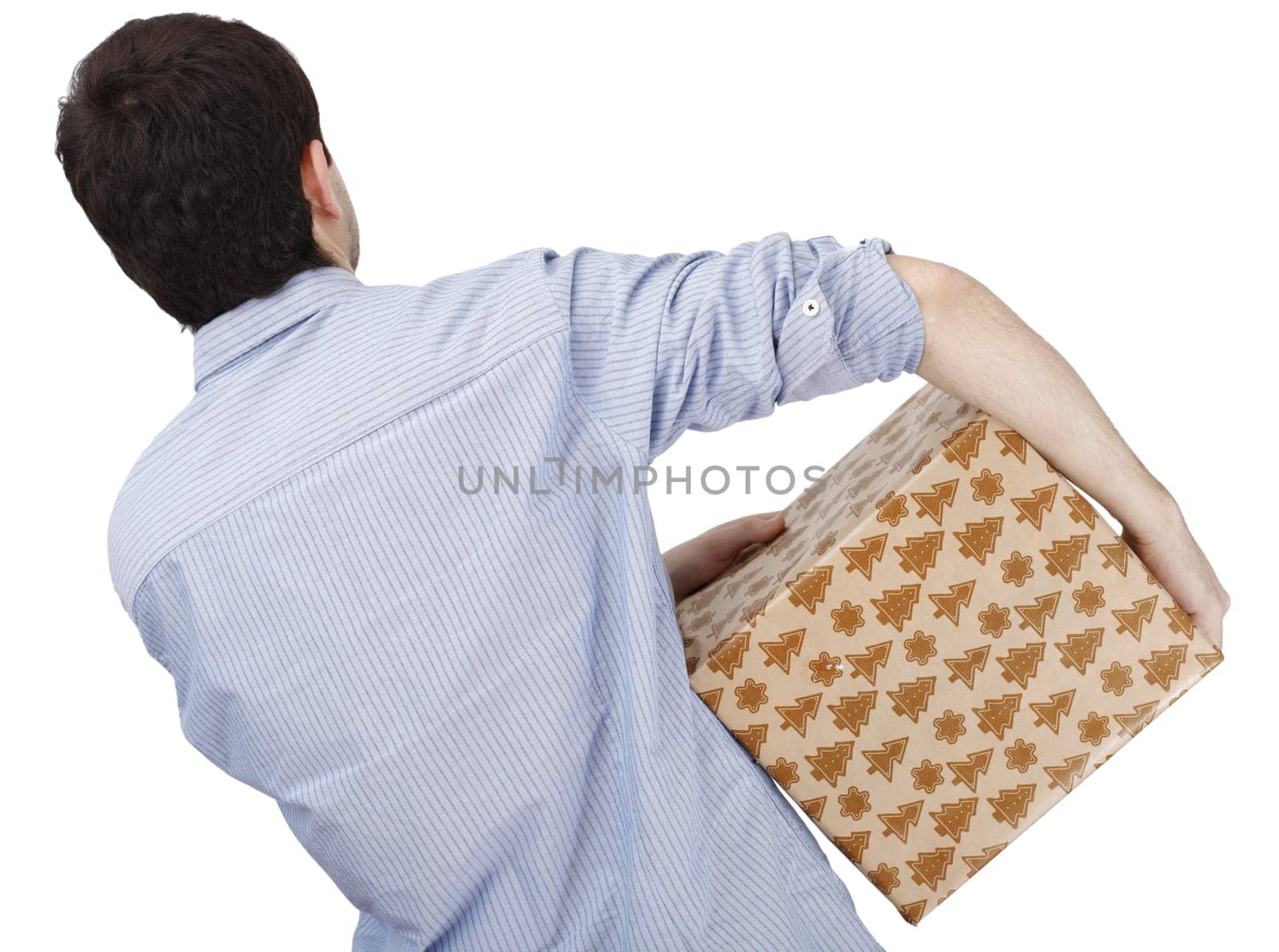 Young man holding a present in hands.