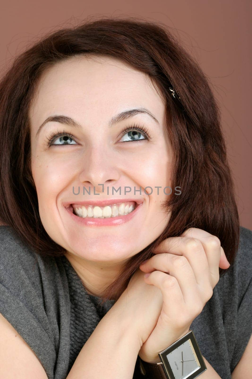 Portrait of a happy beautiful woman with green eyes.