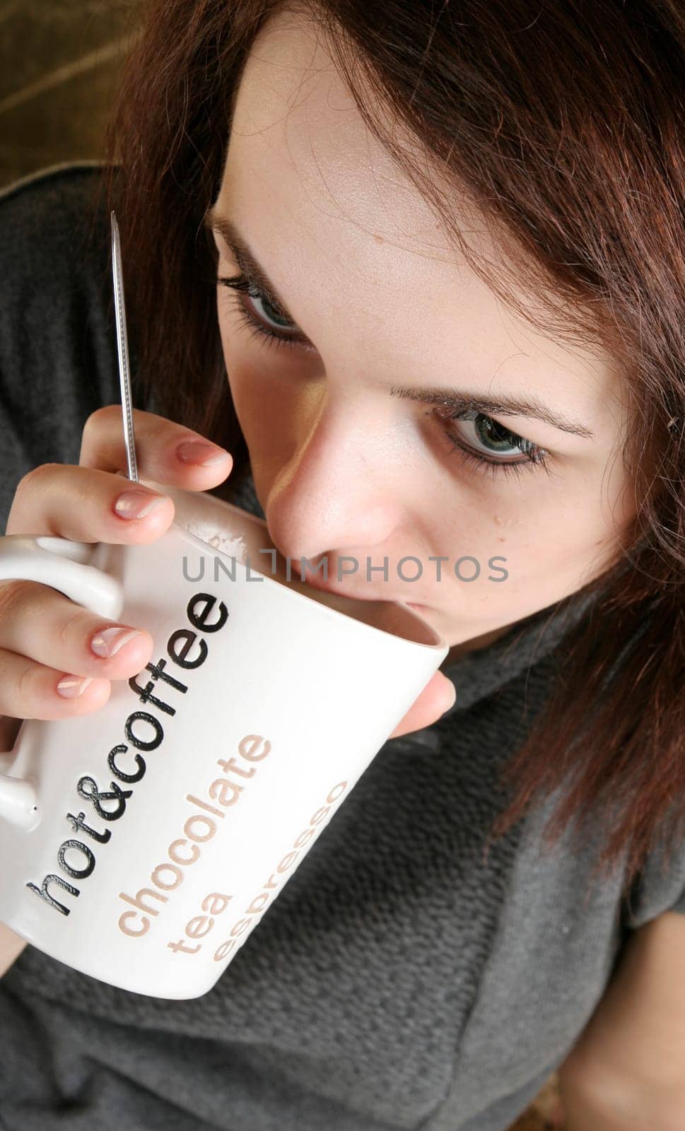 Beautiful woman drinking a cup of coffee