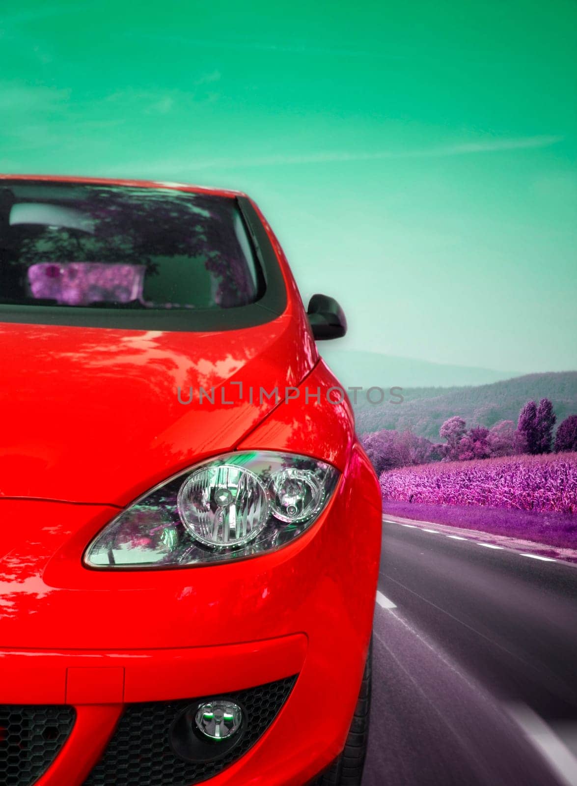 Image of a car viewed from the front on the highway