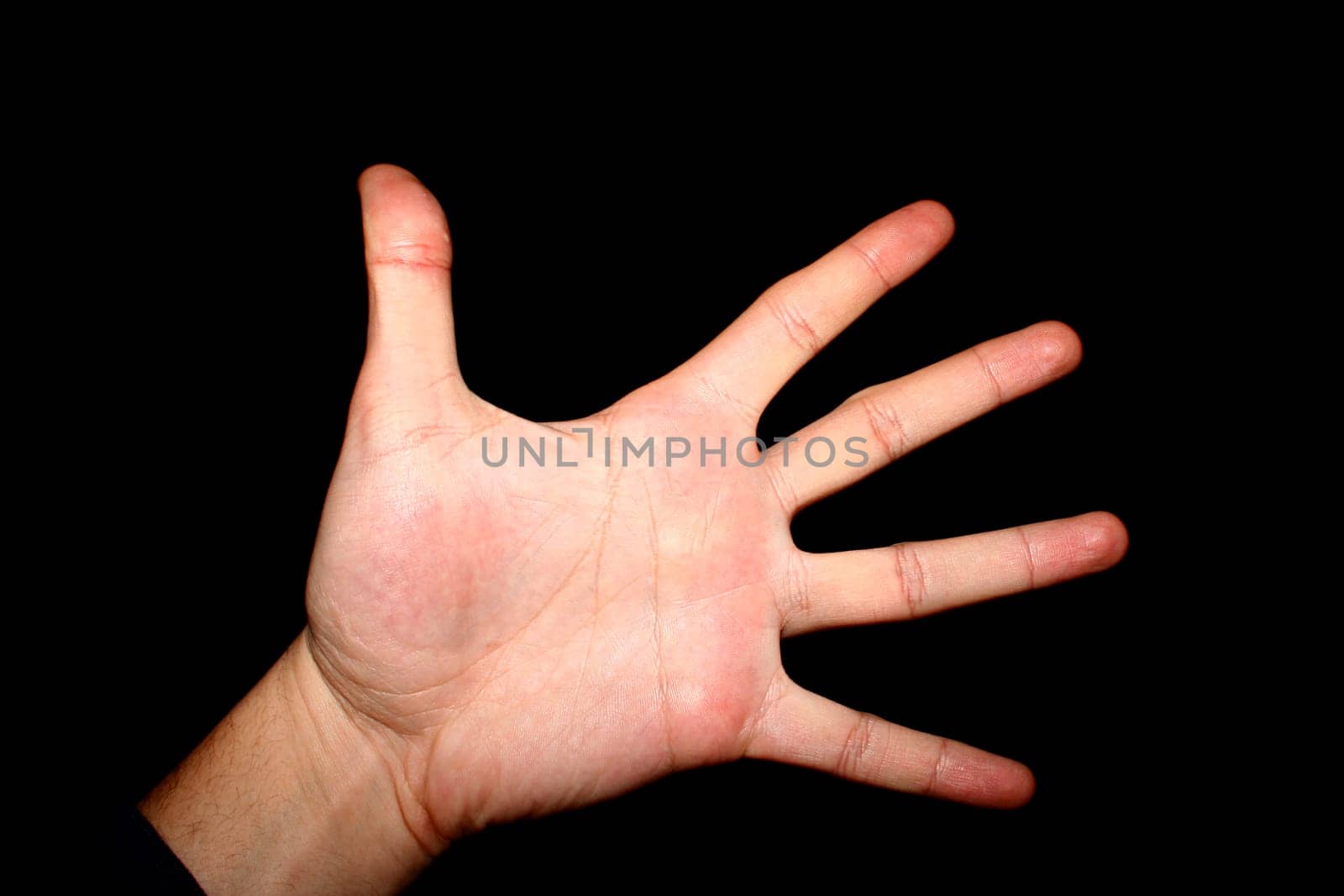 Hand isolated on black - macro