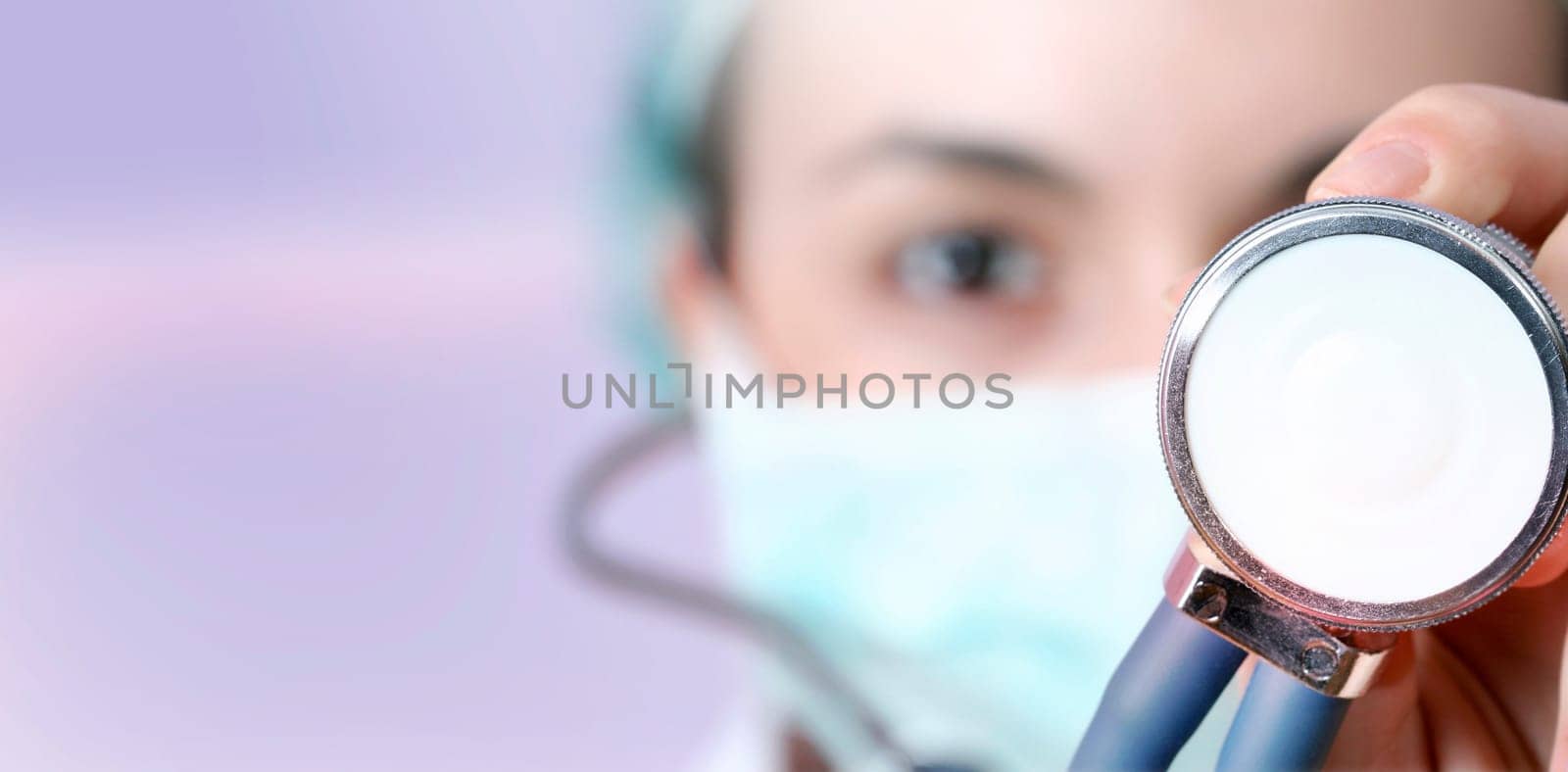 Female doctor with mask and stethoscope.