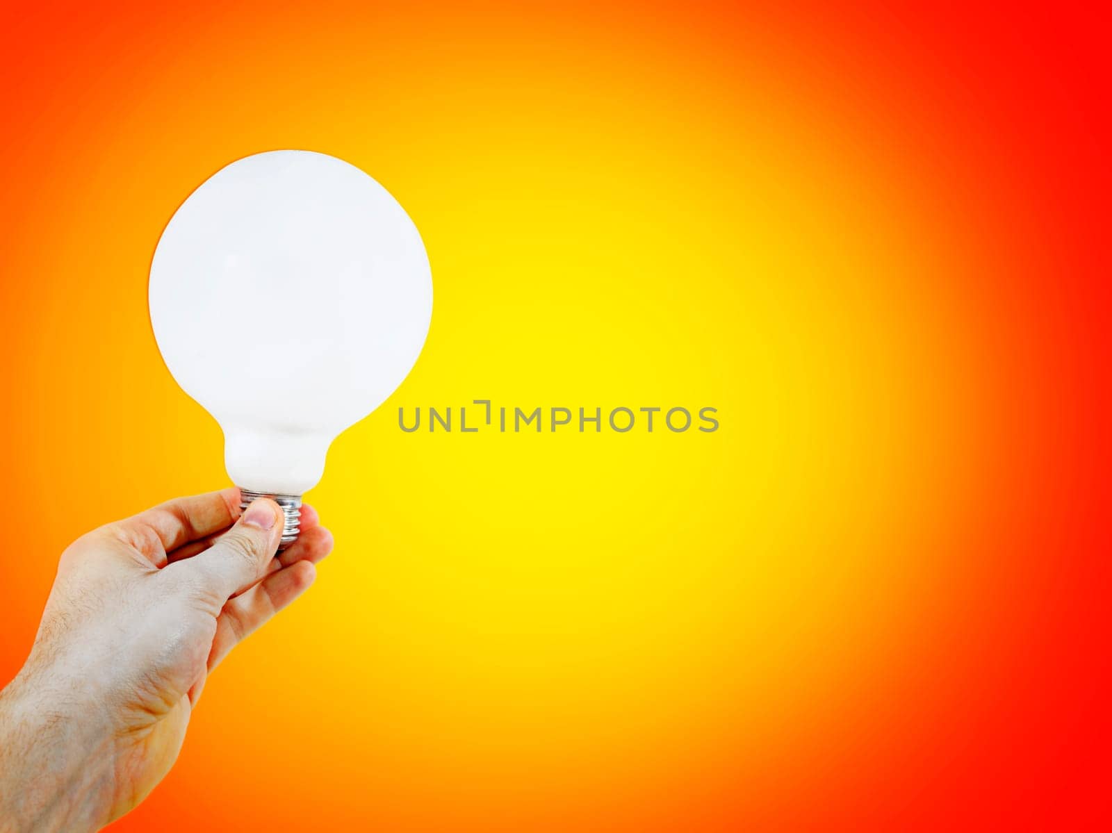 White bulb in a man's hand
