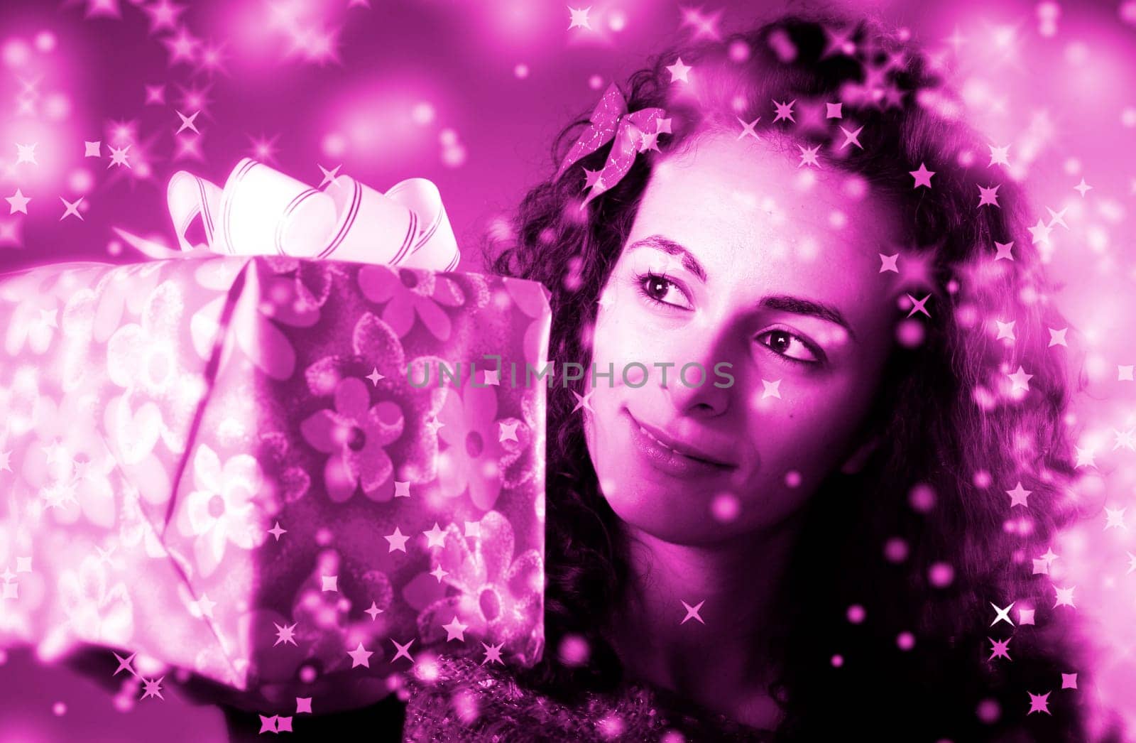 woman with a gift in her hands and snowflakes