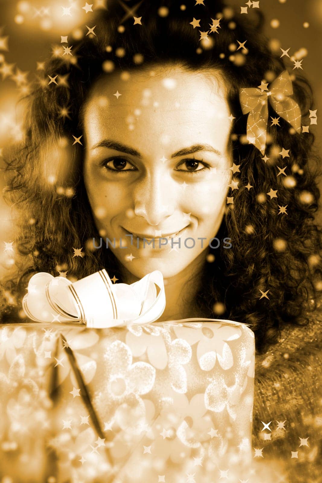 woman with a gift in her hands and snowflakes