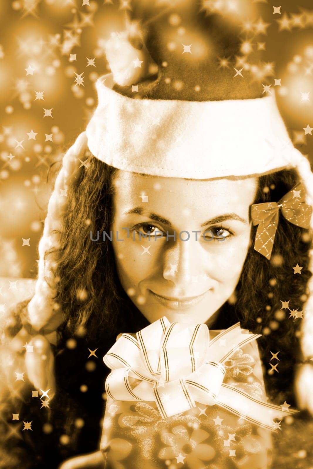 woman with a gift in her hands and snowflakes