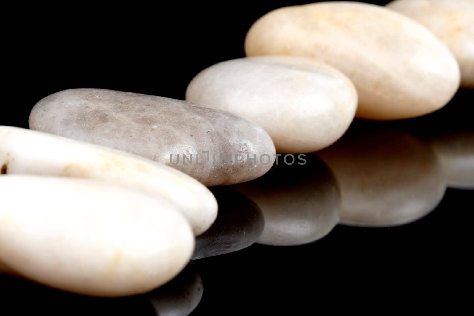 Concept made by many rocks isolated on black.