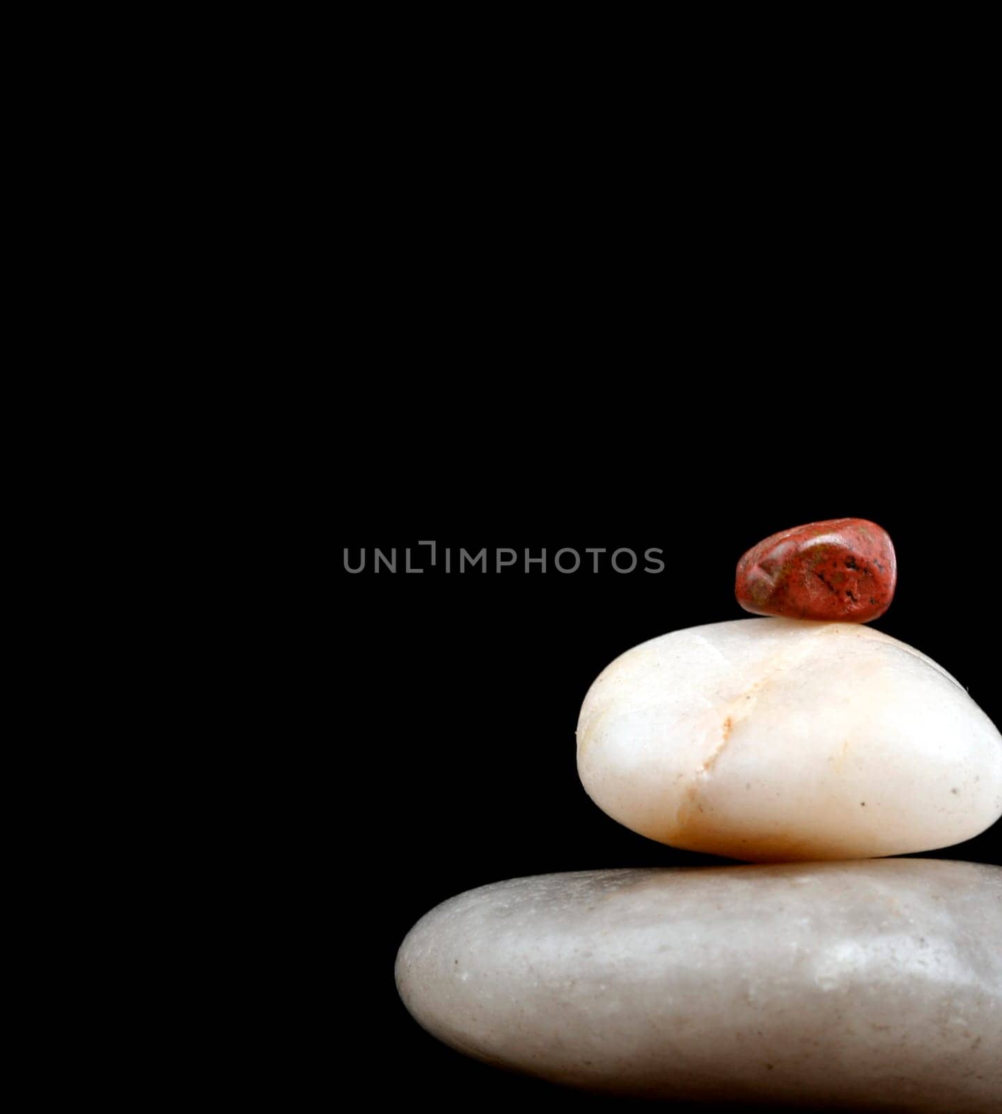 Concept made by many rocks isolated on black.