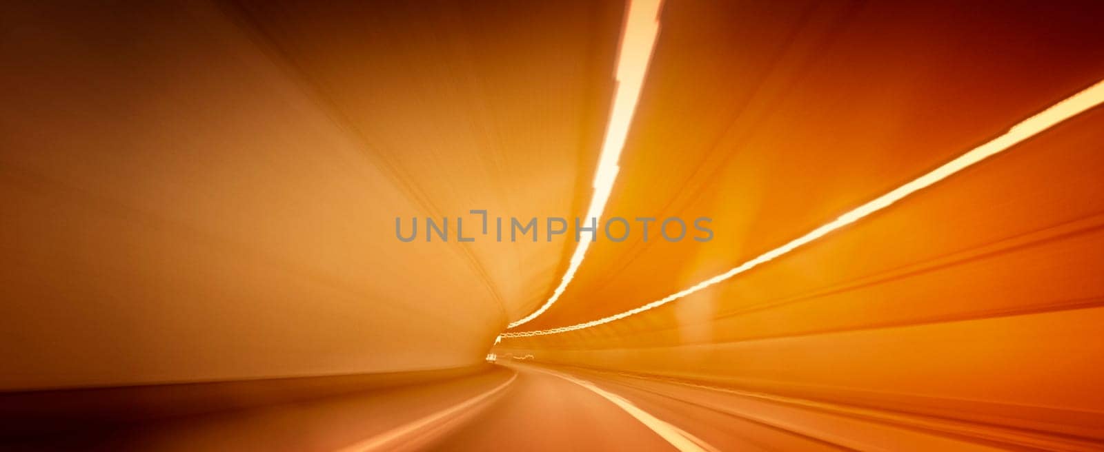 Car lights trails in a tunnel