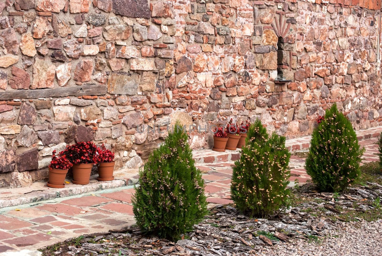 View to stonewall facade of ancient  basilica style orthodox church