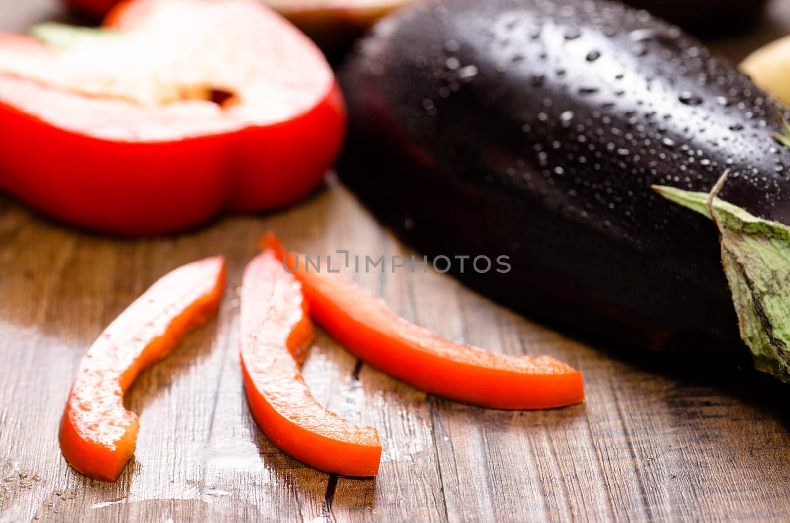 Close-up of red peppers and aubergine