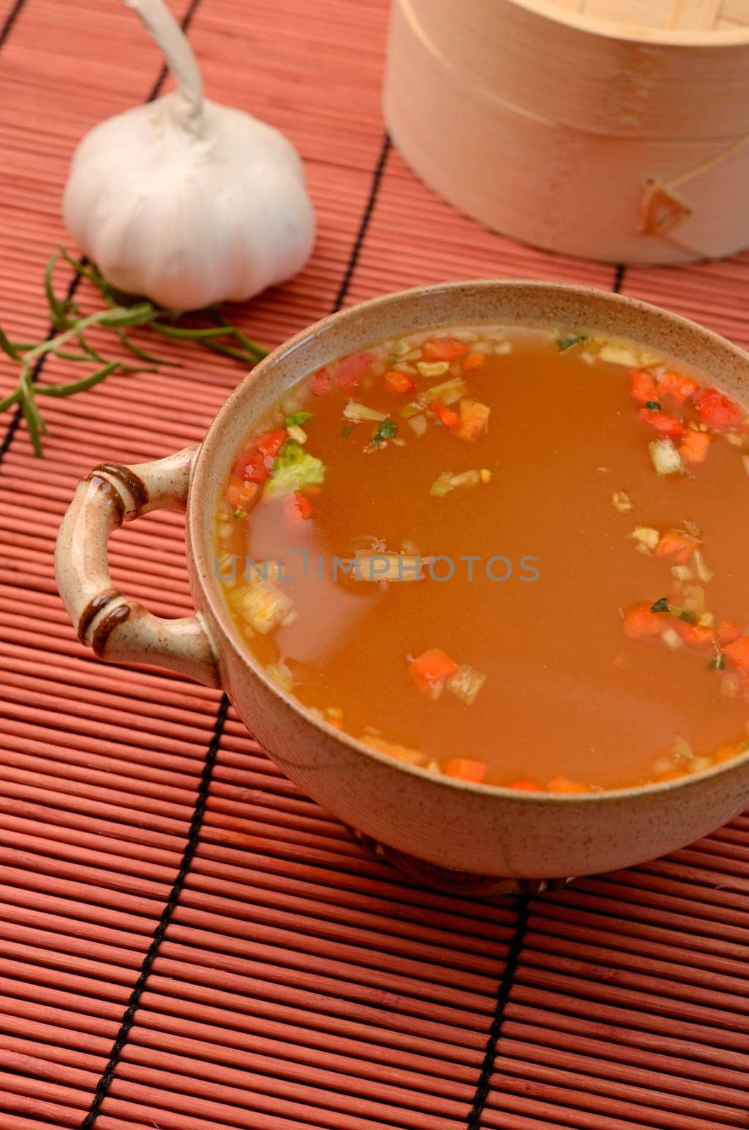 Asian soup an a bamboo mat