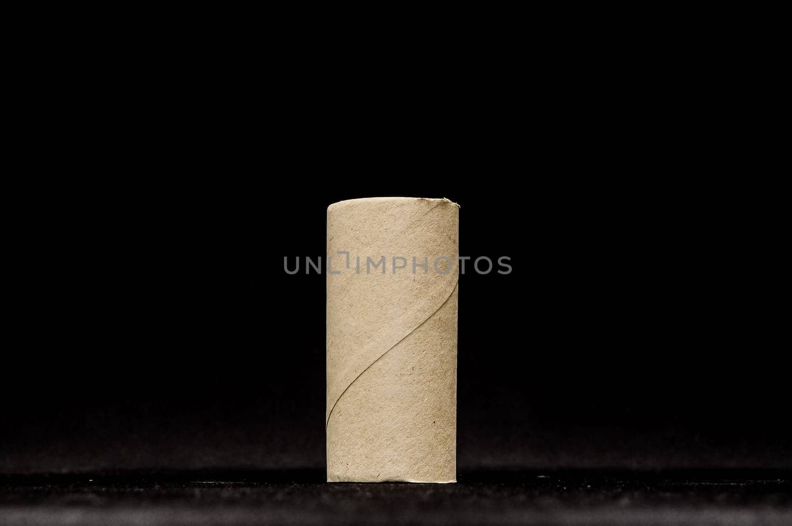 Empty Toilet Rolls Stack Up On a Black Background