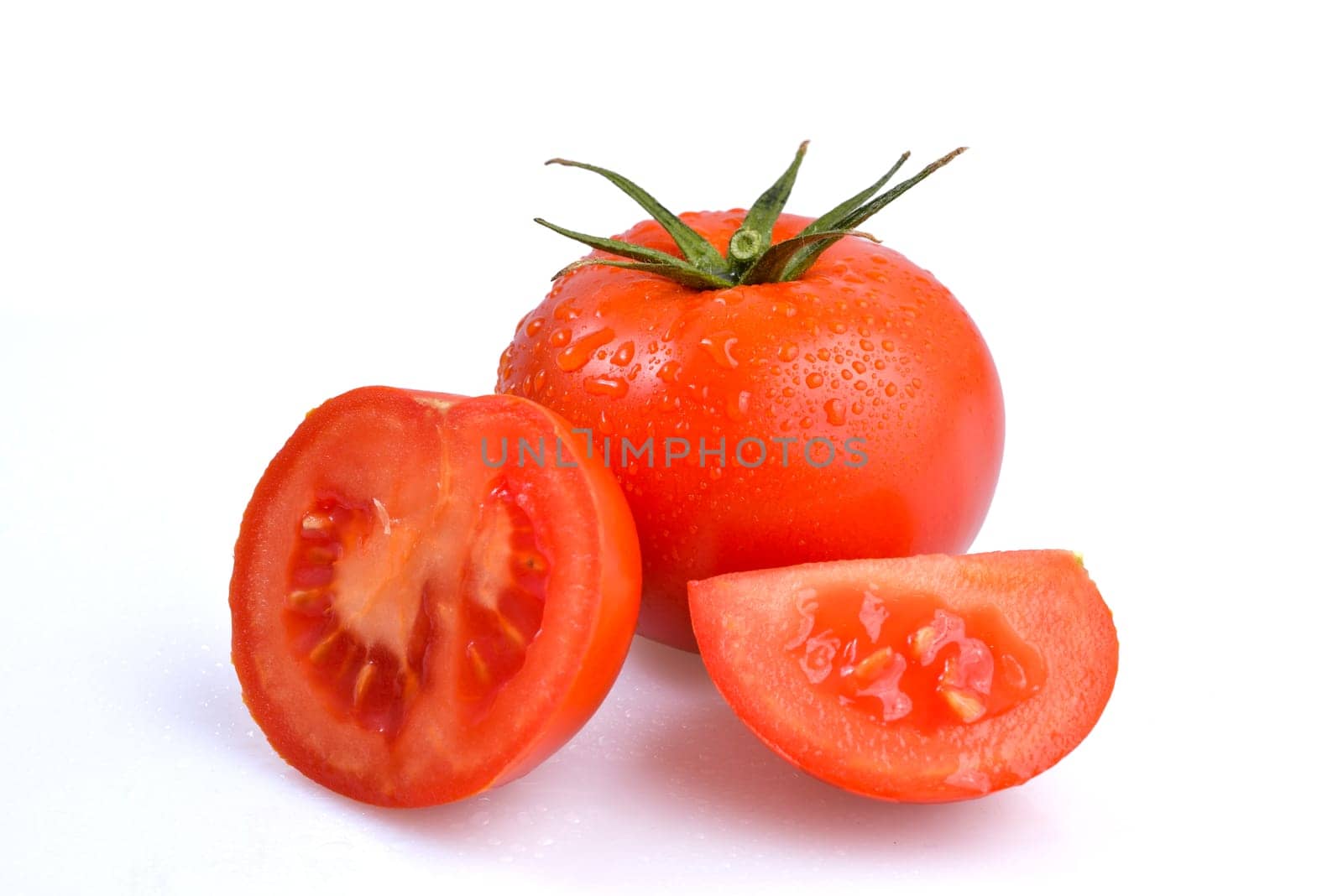 red and ripe tomatoes on a white background