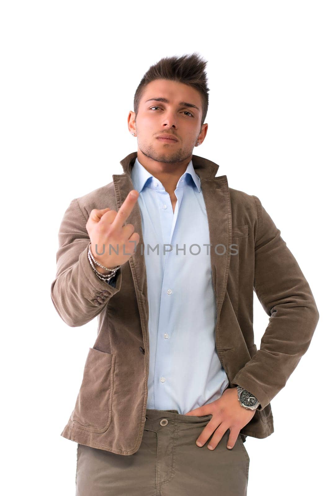 Handsome young man doing 'screw you' sign with middle finger, isolated on white