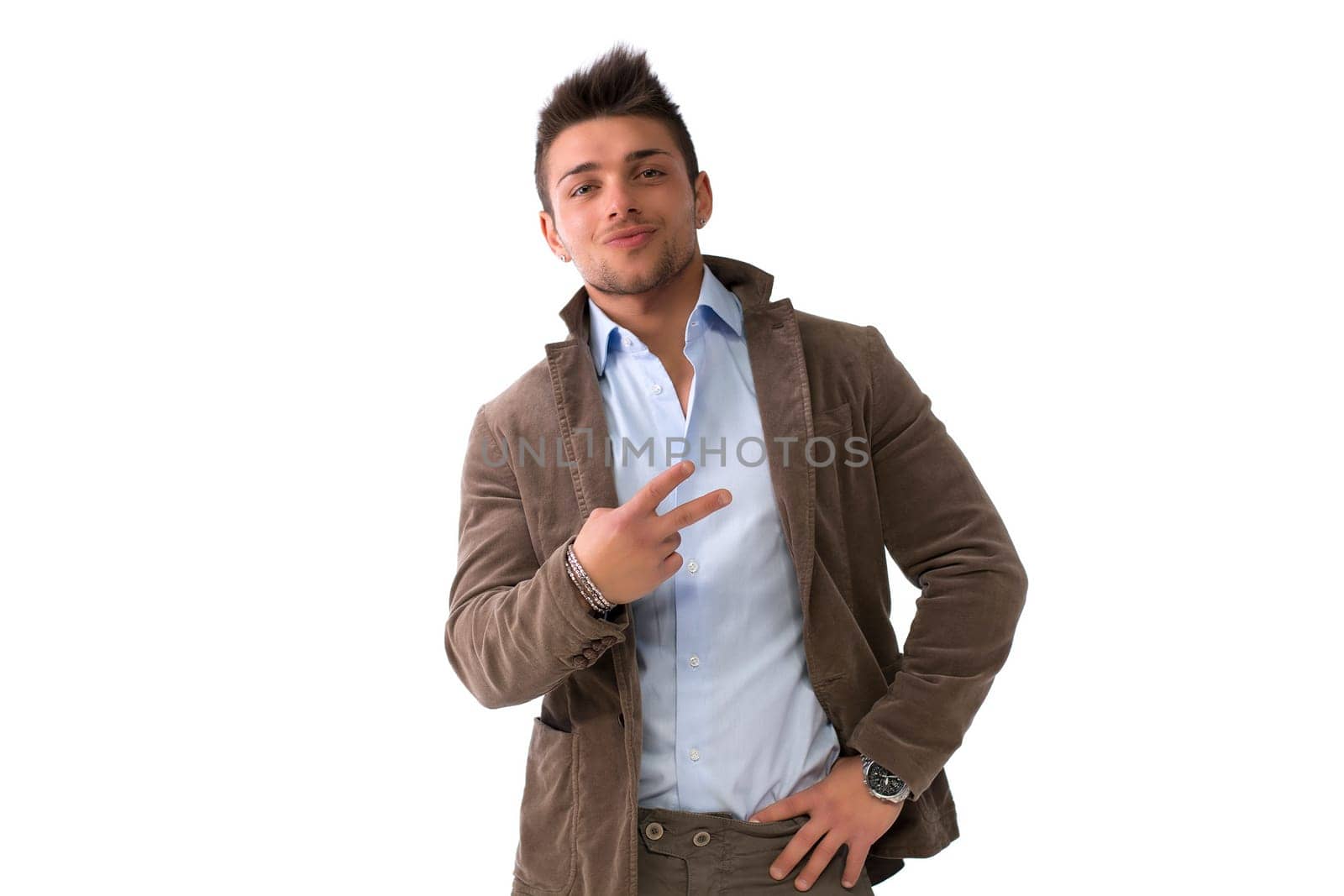 Handsome young man doing victory or peace sign with hand, isolated on white