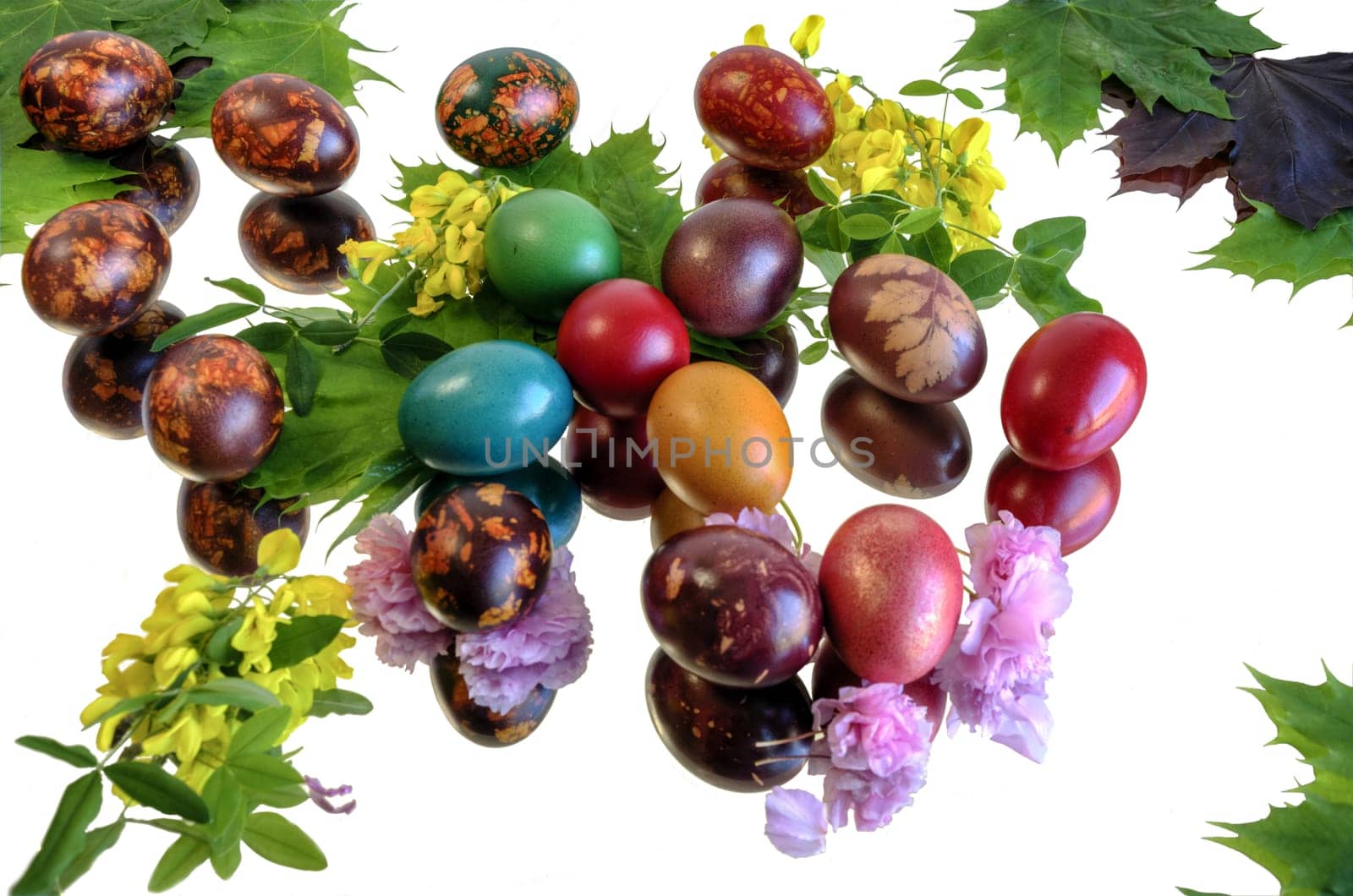 Many beautiful and colorful eggs on mirror floor and clean white background.