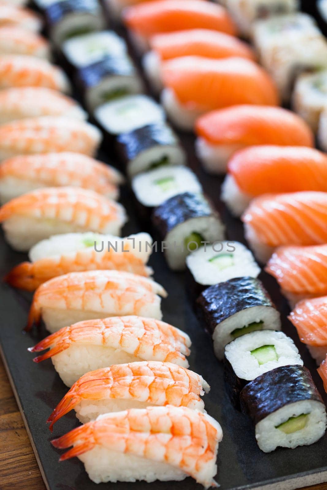 Closeup of rows of healthy freshly prepared sushi rolls
