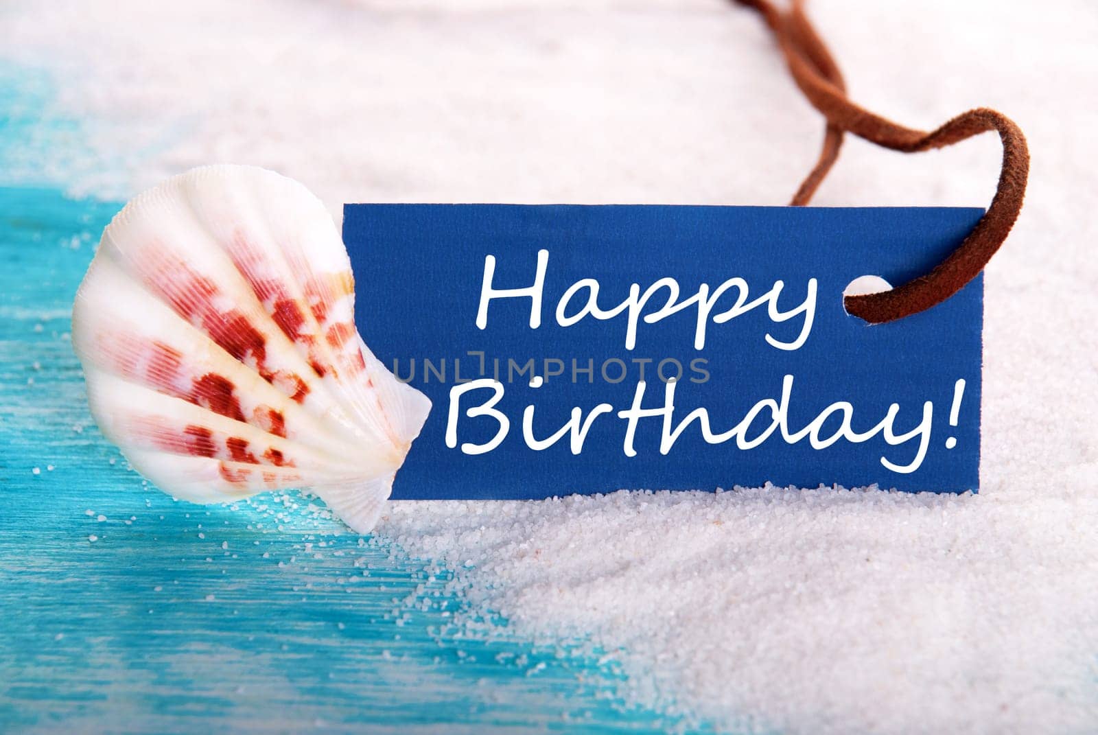 Blue Label with Happy Birthday on it at the Beach