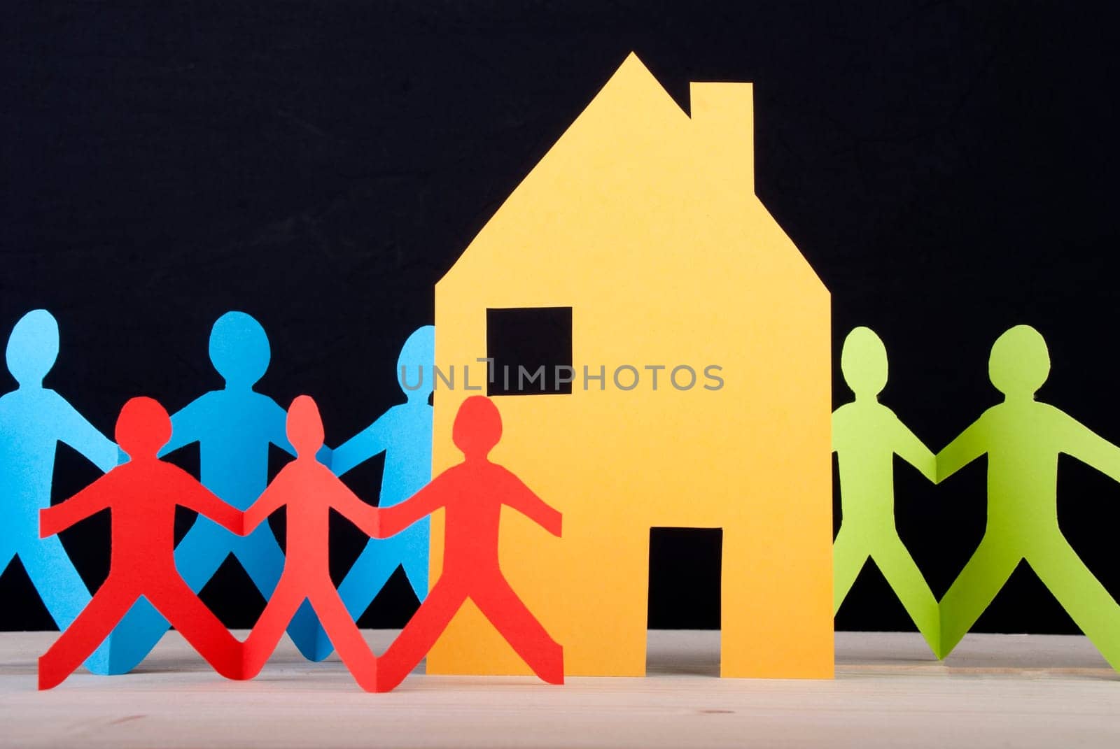 Many Colorful Paper Chain People around a House, Black Background