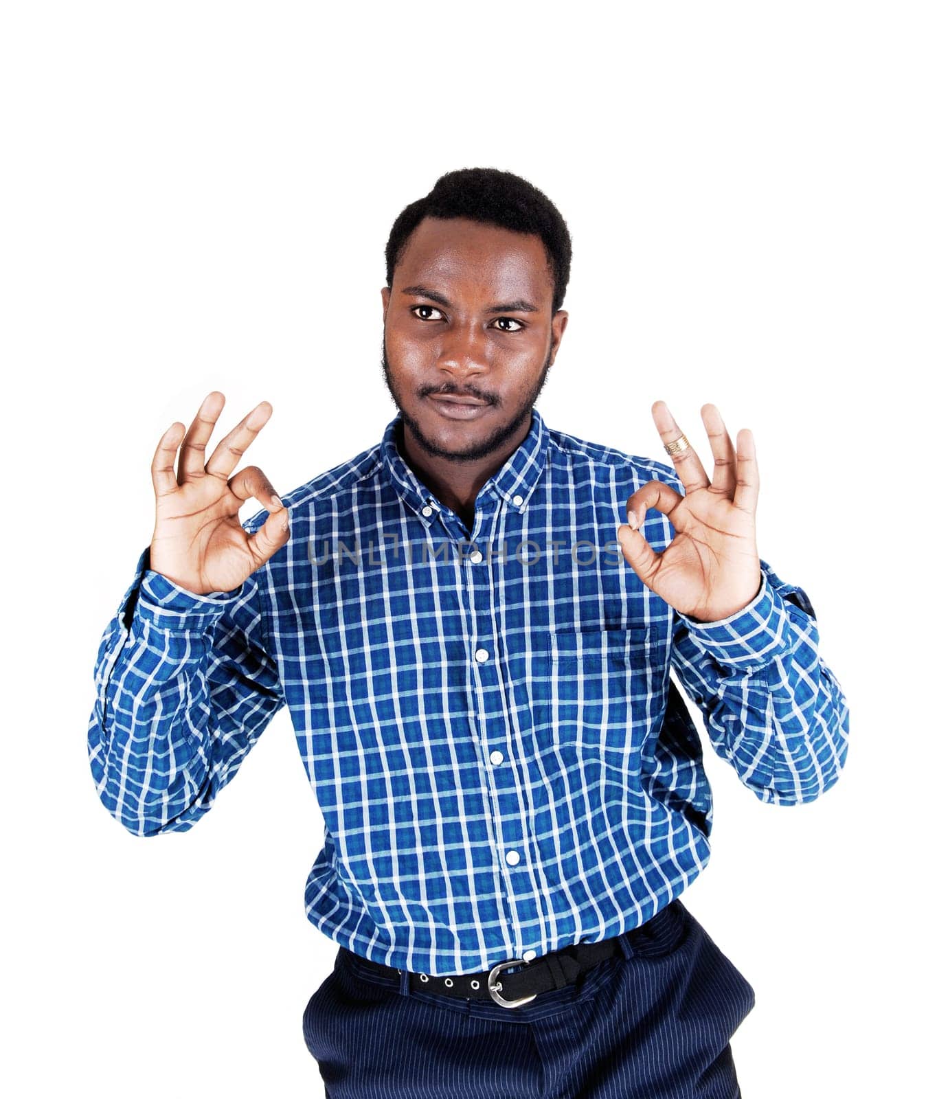 A handsome young black man in a blue shirt with his arms up and.showing the victory sign, isolated for white background..