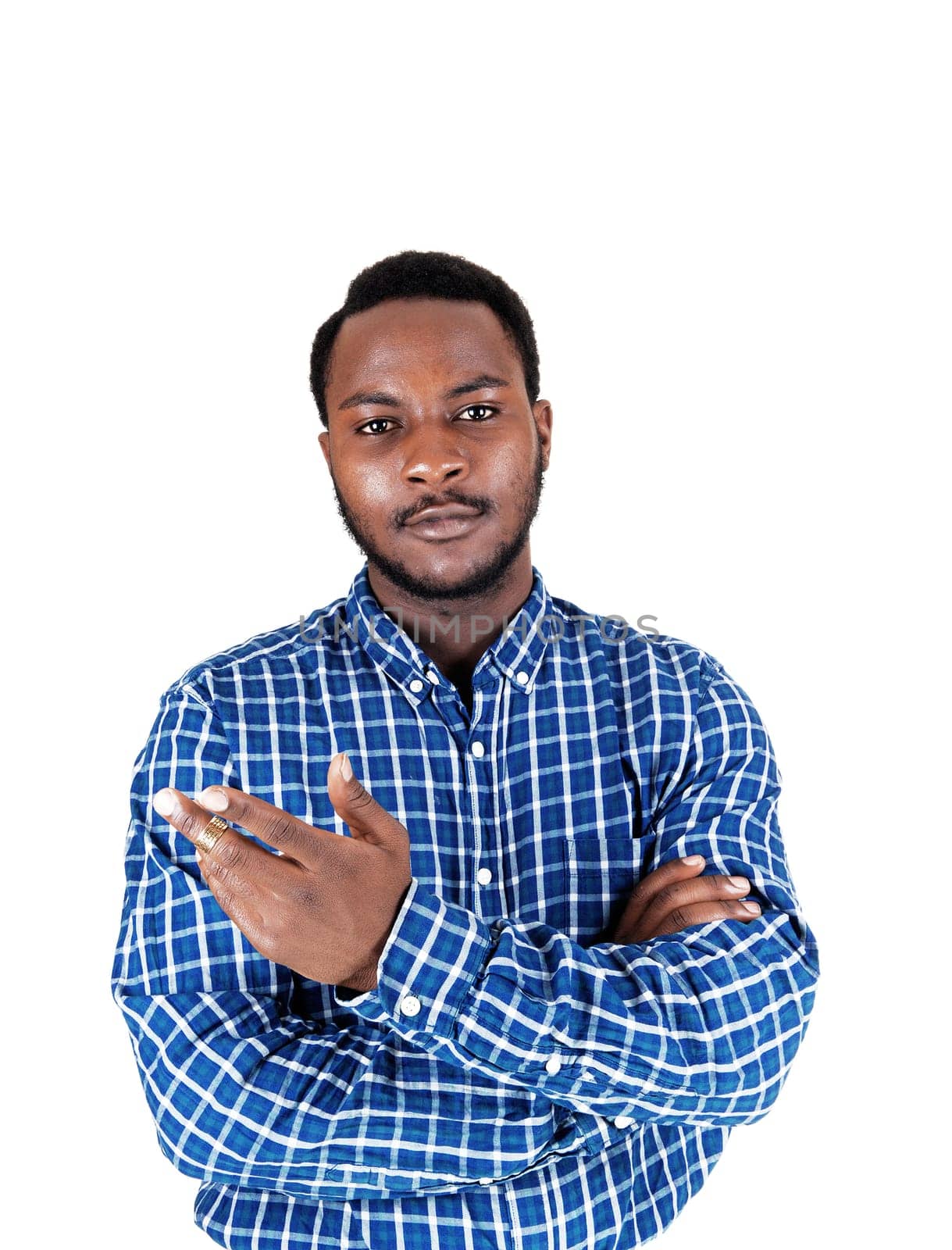 A black young man standing isolated for white background showing with his .hand and looking into the camera..