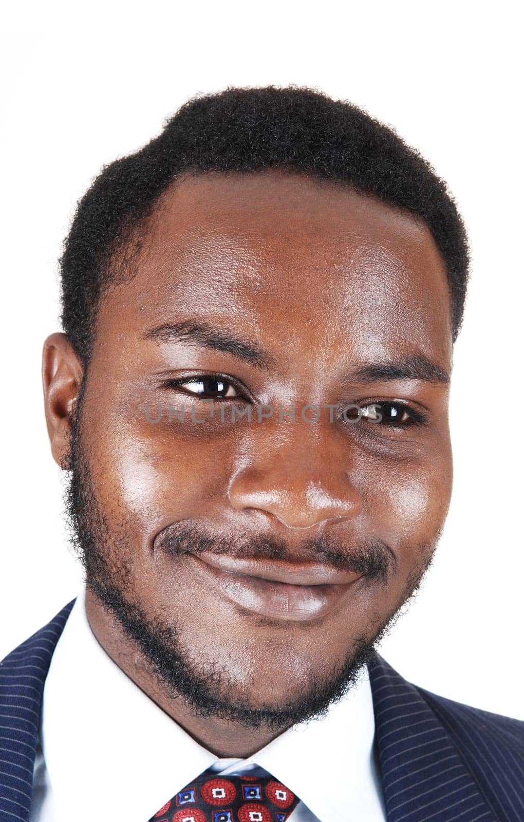 A protract picture of a smiling black man in a suit and tie, isolated for white.background..