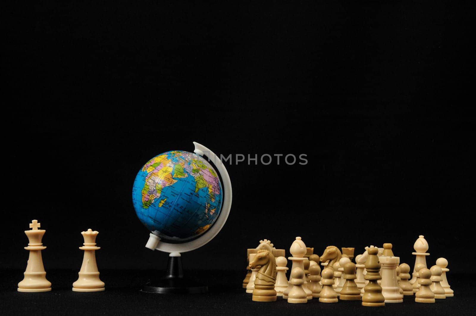Globe And White Chess on a Black Background