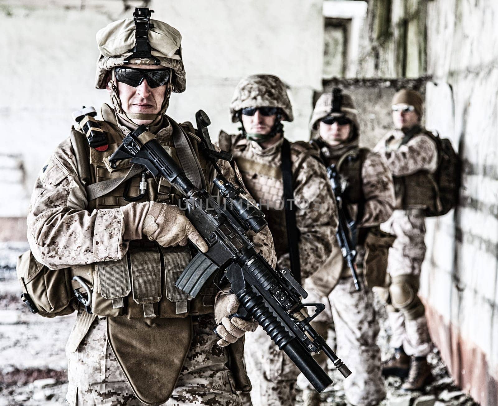 Squad of US marines in ruined building