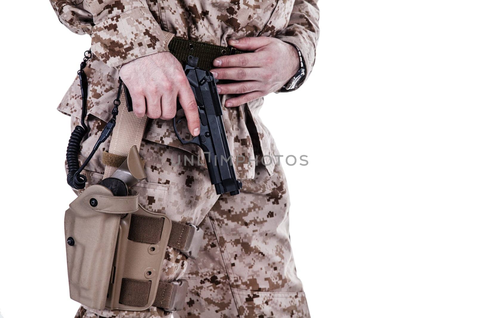 US marine extracting his pistol from a holster