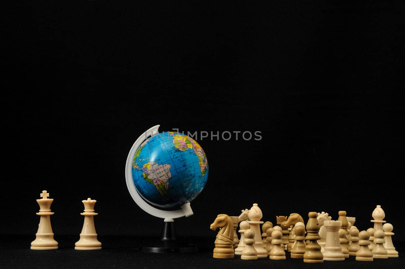 Globe And White Chess on a Black Background