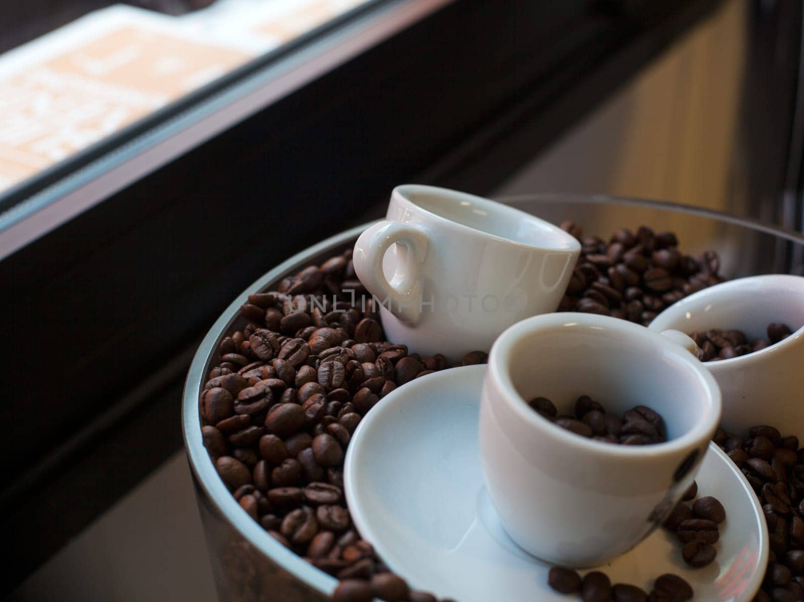 View of coffee cups and coffee beans